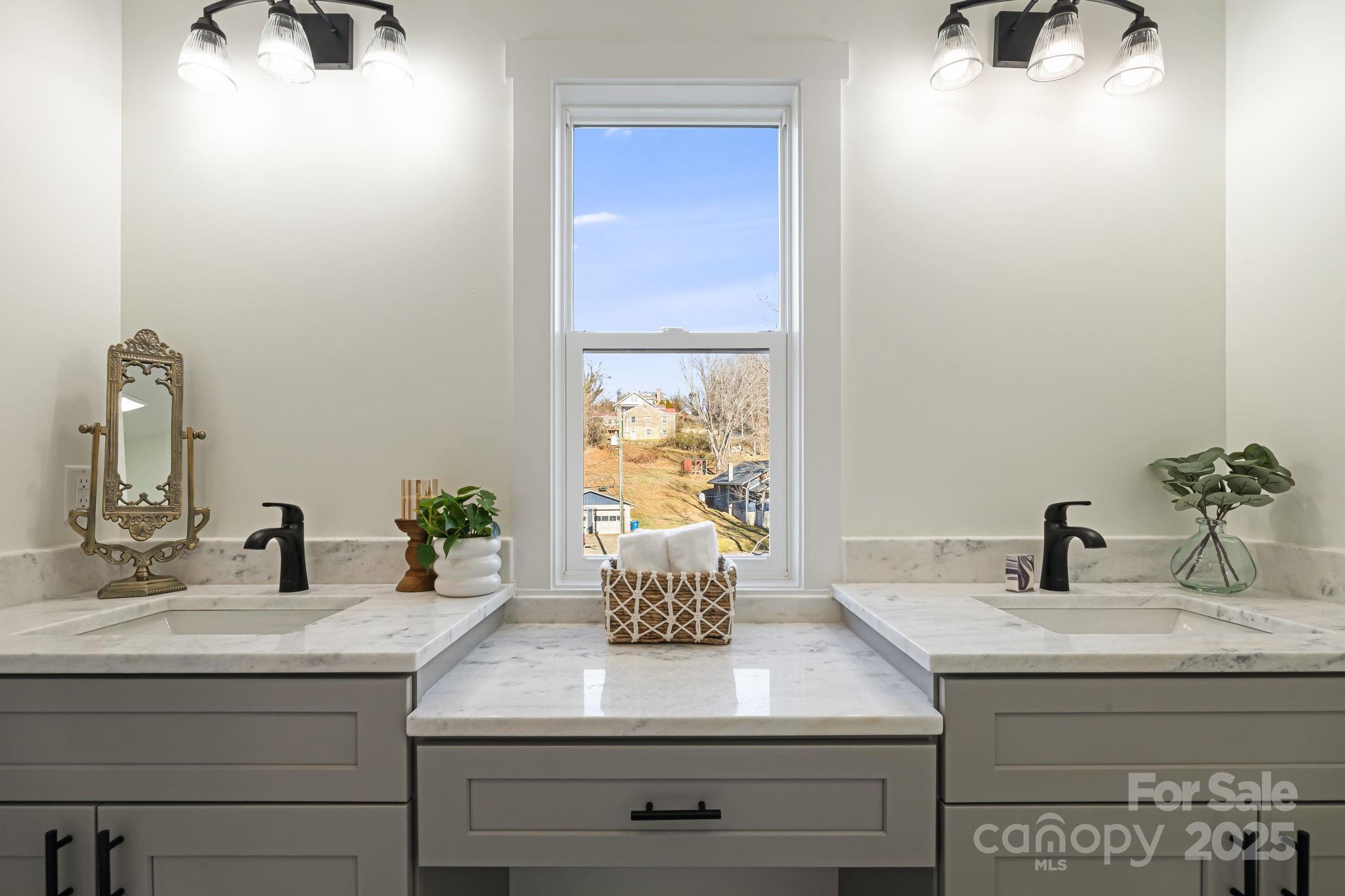 386 Holtzclaw Street Canton, NC 28716 - Photo 30 of 43 a bathroom with a sink and a mirror