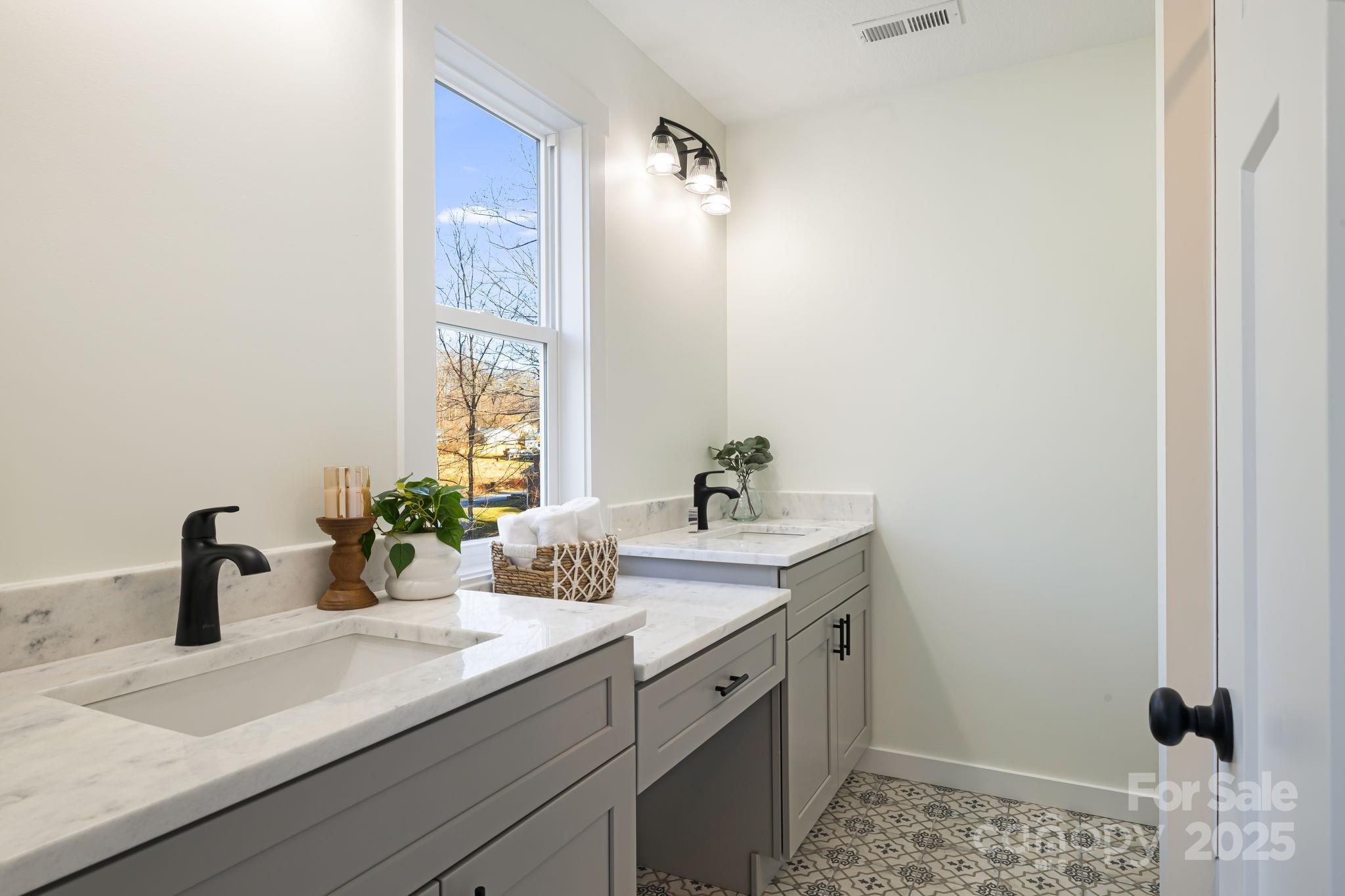 386 Holtzclaw Street Canton, NC 28716 - Photo 31 of 43 a bathroom with a granite countertop sink and a mirror