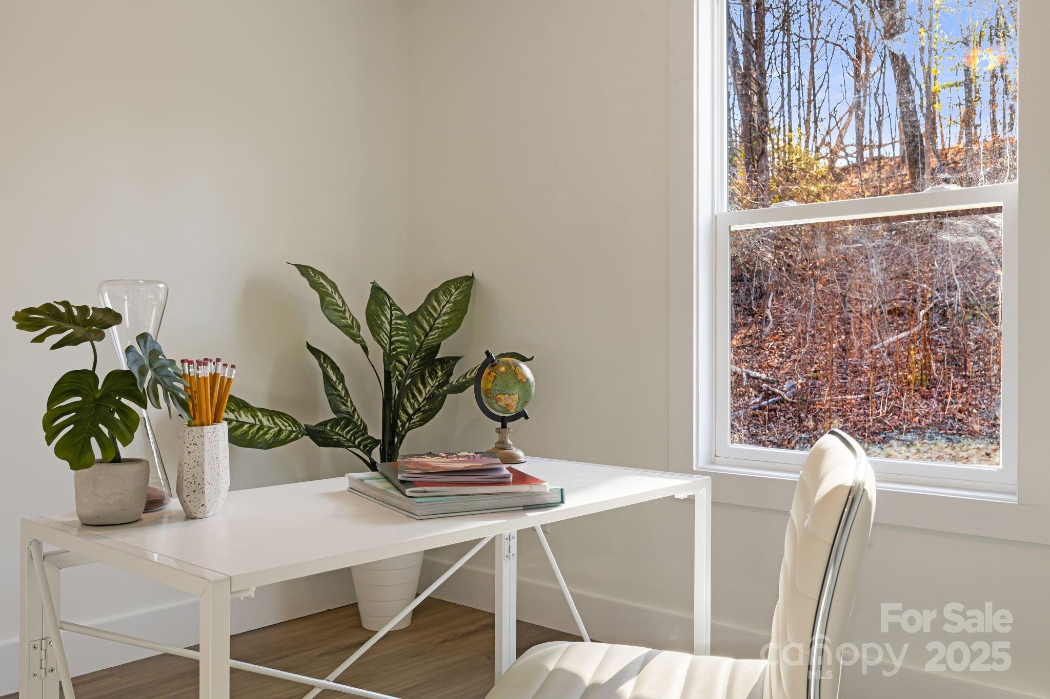 386 Holtzclaw Street Canton, NC 28716 - Photo 35 of 43 a view of a dining room with furniture and wooden floor