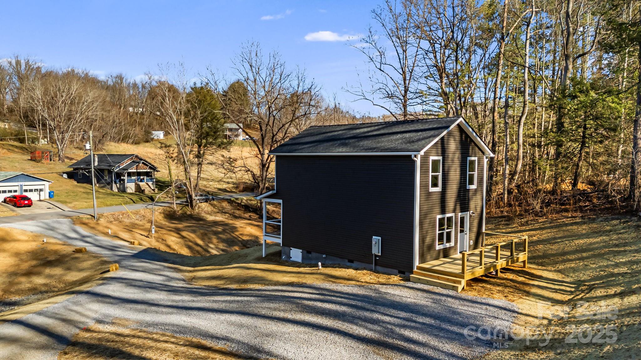 386 Holtzclaw Street Canton, NC 28716 - Photo 40 of 43 a view of a house with a yard