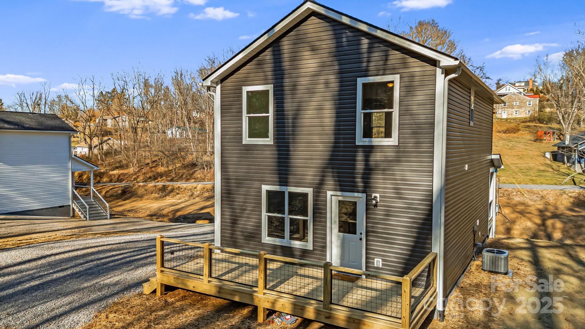 386 Holtzclaw Street Canton, NC 28716 - Photo 5 of 43 a view of a house with a door and wooden floor