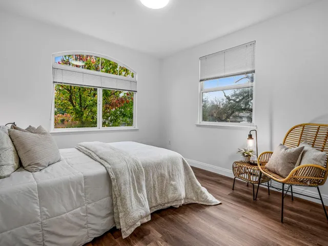 a bedroom with a bed and window