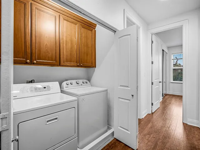 a view of storage and utility room with washer and dryer