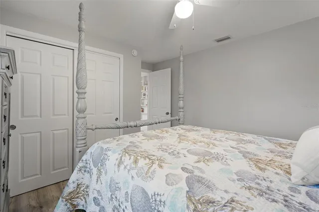 a bedroom with a bed and a closet