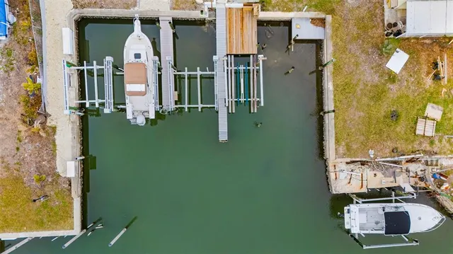 an aerial view of residential house with outdoor space and parking