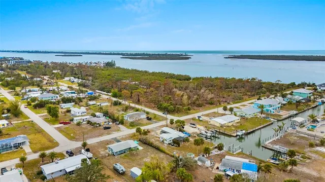 an aerial view of residential building and ocean