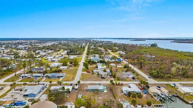 an aerial view of residential building and ocean