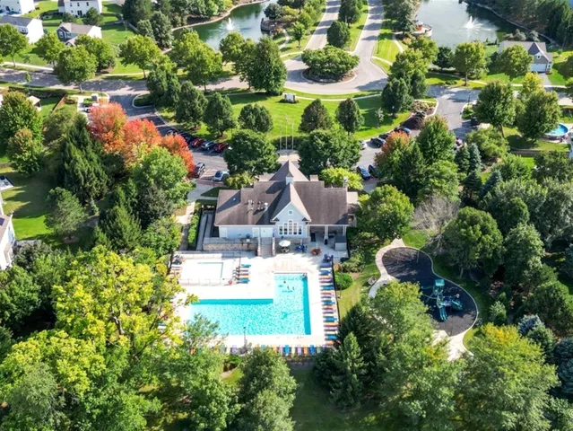 an aerial view of house with yard