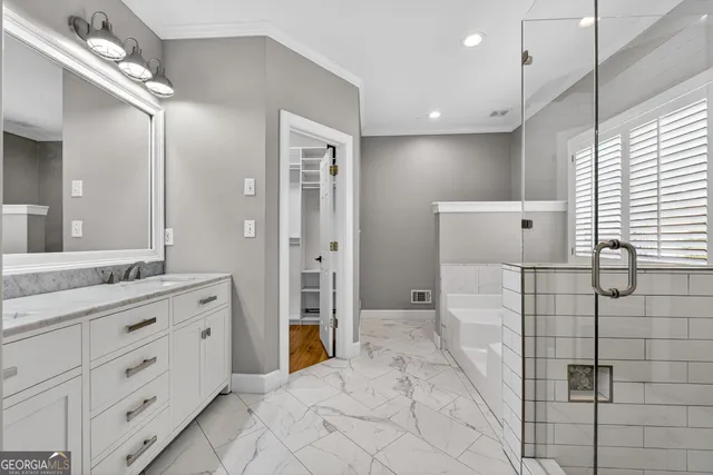 a bathroom with a sink vanity and a mirror