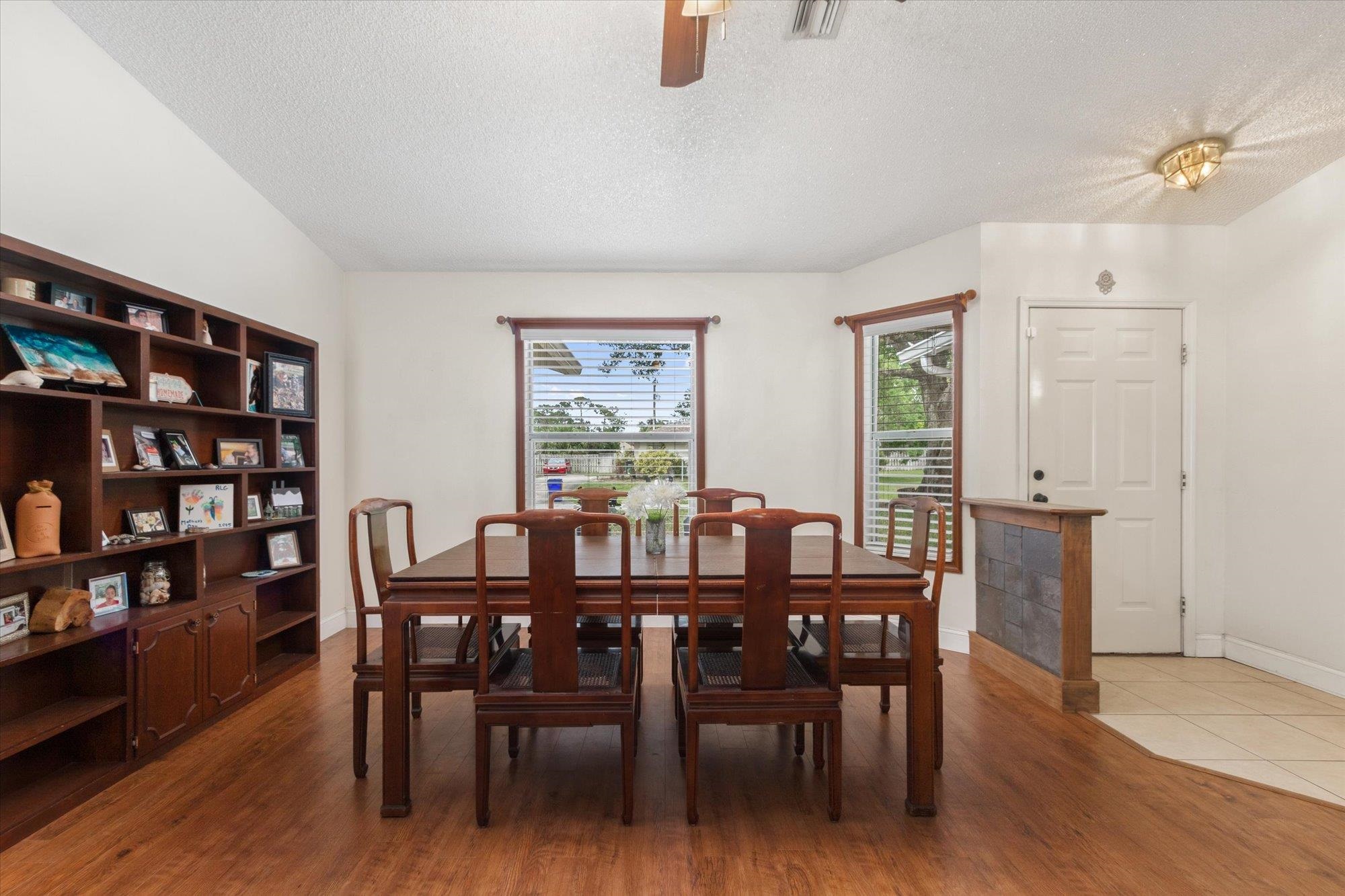 2910 Yule Tree Drive Edgewater, FL 32141 - Photo 8 of 44 a view of a dining room with furniture and wooden floor