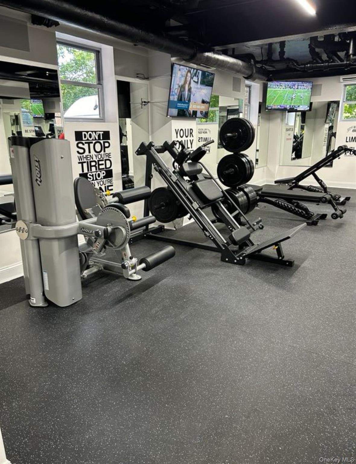 230 Pelham Road, Unit 6F New Rochelle, NY 10805 - Photo 14 of 28 a room with gym equipment and a large window