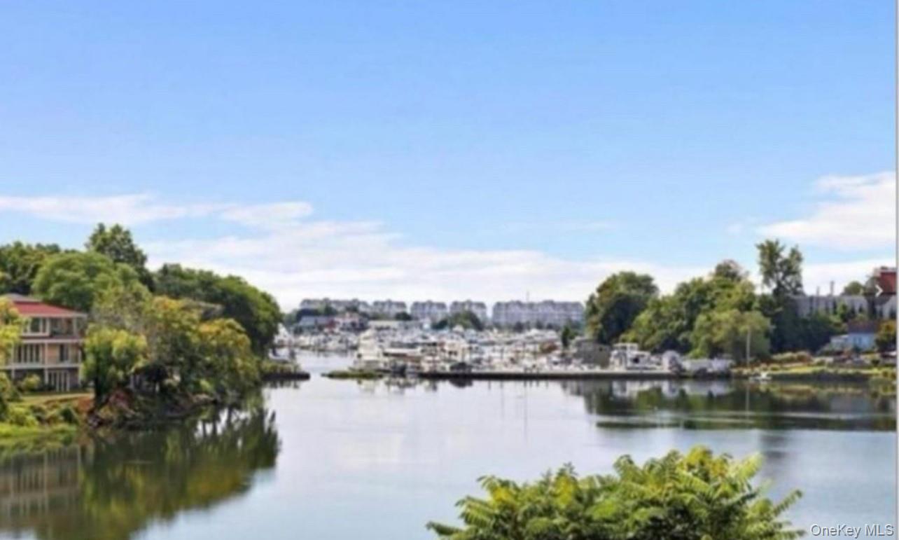 230 Pelham Road, Unit 6F New Rochelle, NY 10805 - Photo 28 of 28 a view of a lake with houses