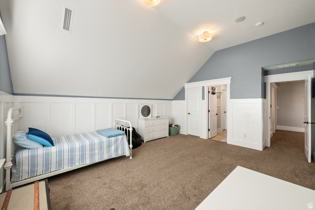 1205 North Elk Rdg Lane, Unit 202 Alpine, UT 84004 - Photo 62 of 88 Room featuring textured carpeting, wainscoting, and a sloped ceiling