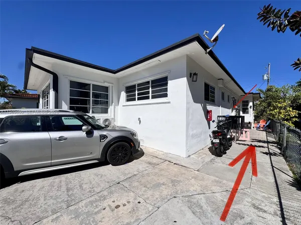 a view of garage with a car parked in garage