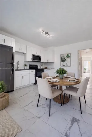 a view of a dining room with furniture