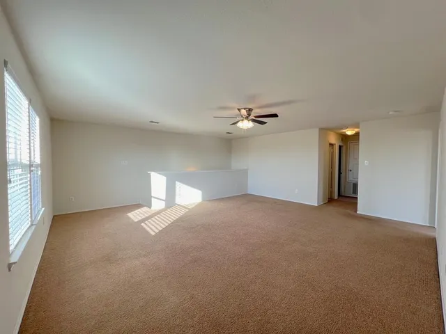 a bathroom with a sink double vanity granite tub shower and a mirror
