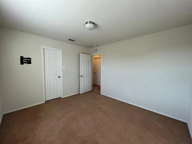 a view of empty room with windows
