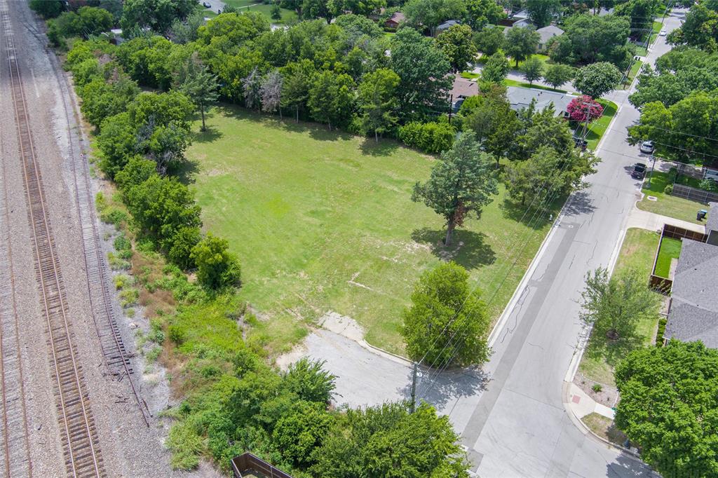 Tbd Lot 1 R West Tbd Street Fort Worth, TX 76110 - Photo 2 of 2 an aerial view of residential house with outdoor space and trees all around