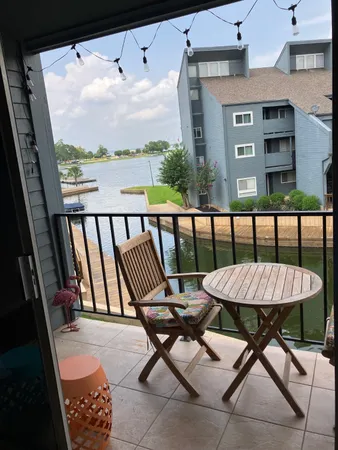 a view of a balcony with furniture