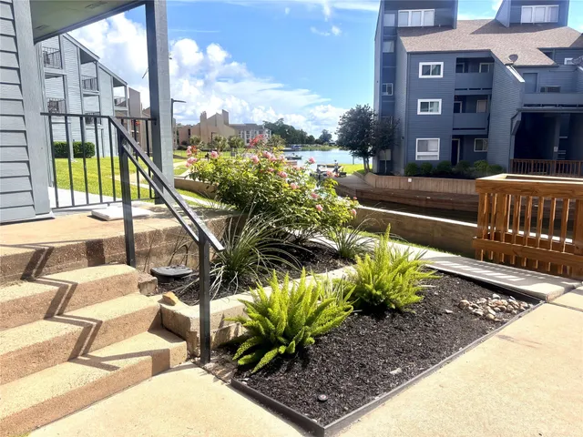 a view of a chairs and table in the patio