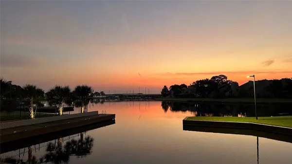 a view of a lake with sitting area