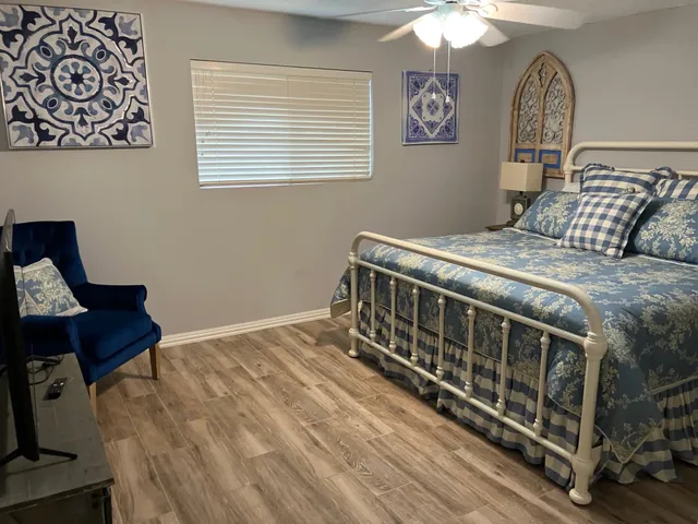 a bedroom with bed and a window