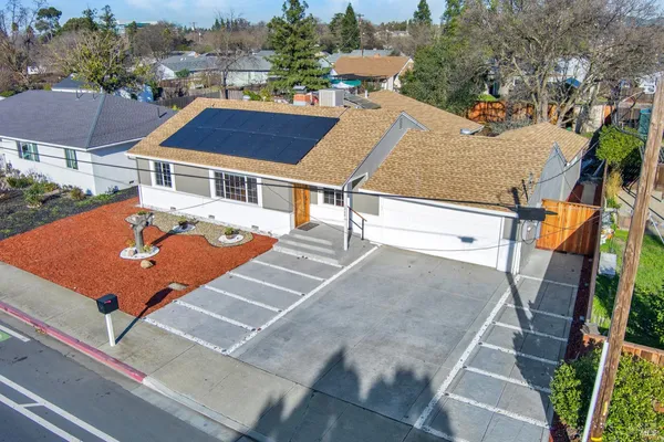 an aerial view of a house with swimming pool