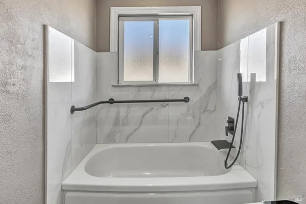 a bathroom with a bathtub