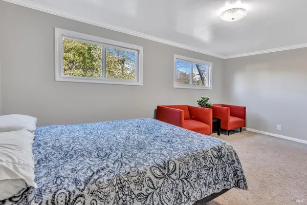 a bedroom with bed and window