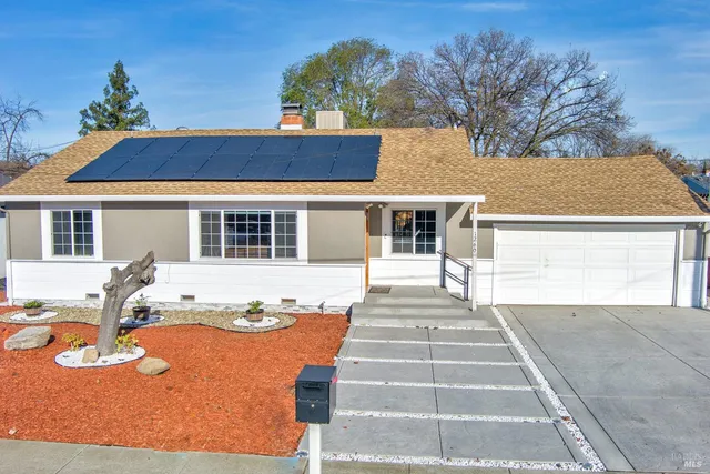 a front view of a house with yard
