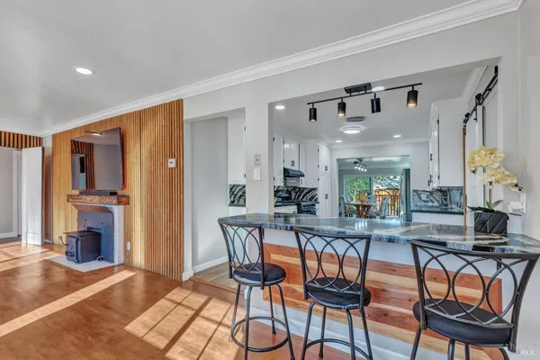 a view of a dining room with furniture and a fireplace