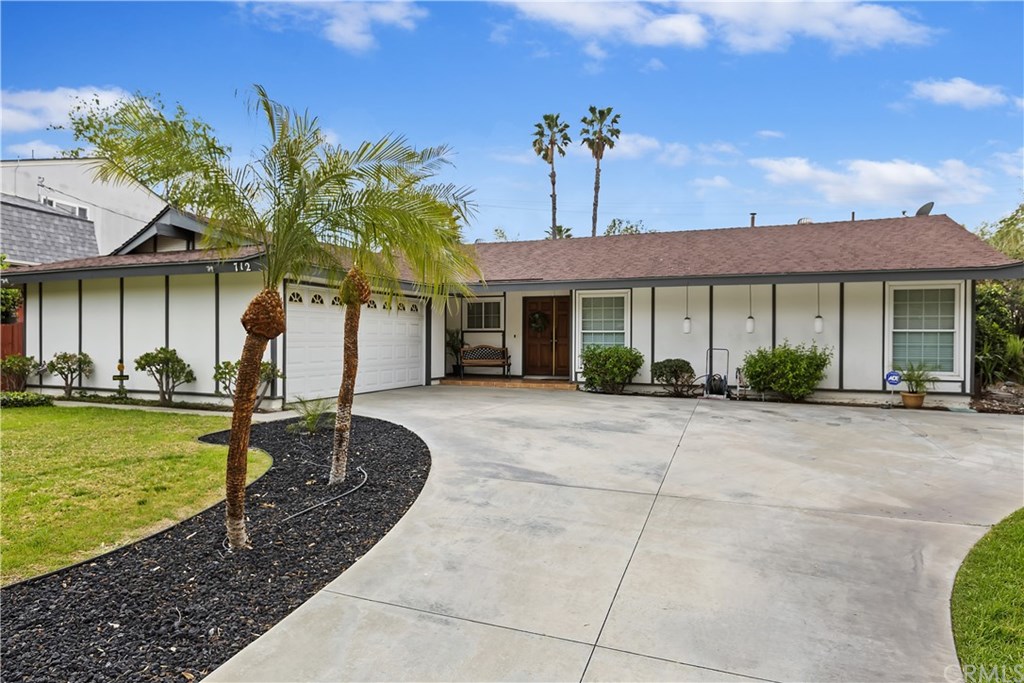 712 Spruce Street Riverside, CA 92507 - Photo 1 of 1 a front view of a house with garden