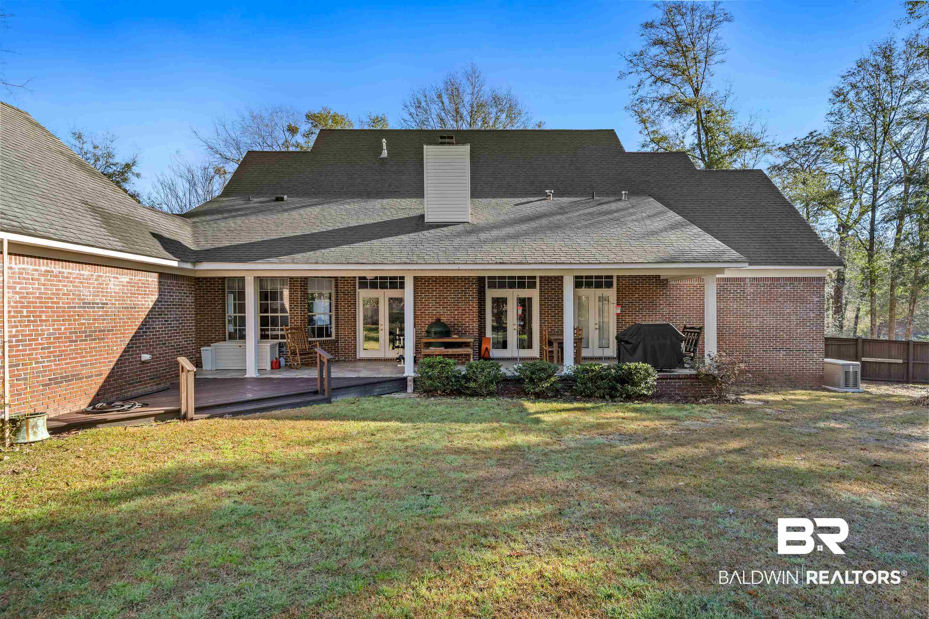 31267 Blakeley Ridge Court Spanish Fort, AL 36527 - Photo 53 of 61 Back of property with french doors, brick siding, a yard, and a chimney