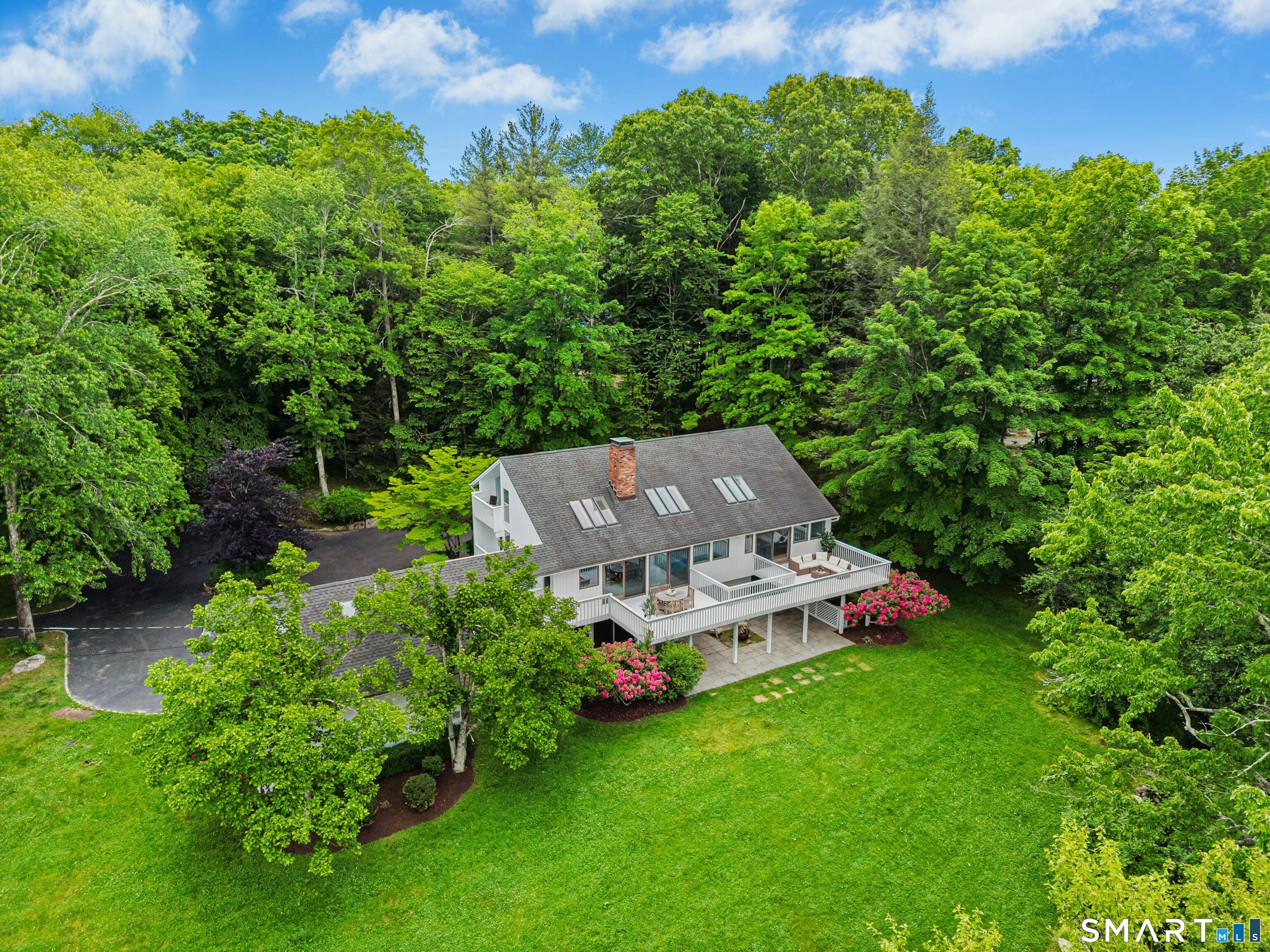38 Old Redding Road Weston, CT 06883 - Photo 1 of 40 This sun-kissed contemporary captivates with private panoramic views overlooking the forever-green 14th and 15th fairways of Aspetuck Country Club.