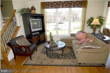 2510 Cherry Tree Road Hanover, MD 21076 - Photo 4 of 13 a living room with furniture and a fireplace