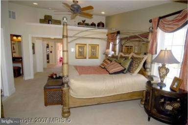 2510 Cherry Tree Road Hanover, MD 21076 - Photo 5 of 13 a bedroom with a bed a couch and dresser