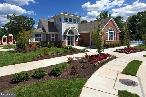 2510 Cherry Tree Road Hanover, MD 21076 - Photo 7 of 13 a front view of a house with a yard and garage