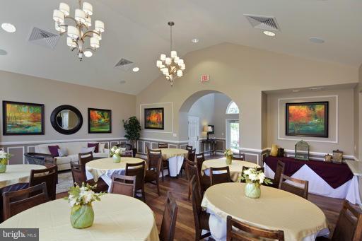 2510 Cherry Tree Road Hanover, MD 21076 - Photo 9 of 13 a living room with fireplace furniture and a chandelier