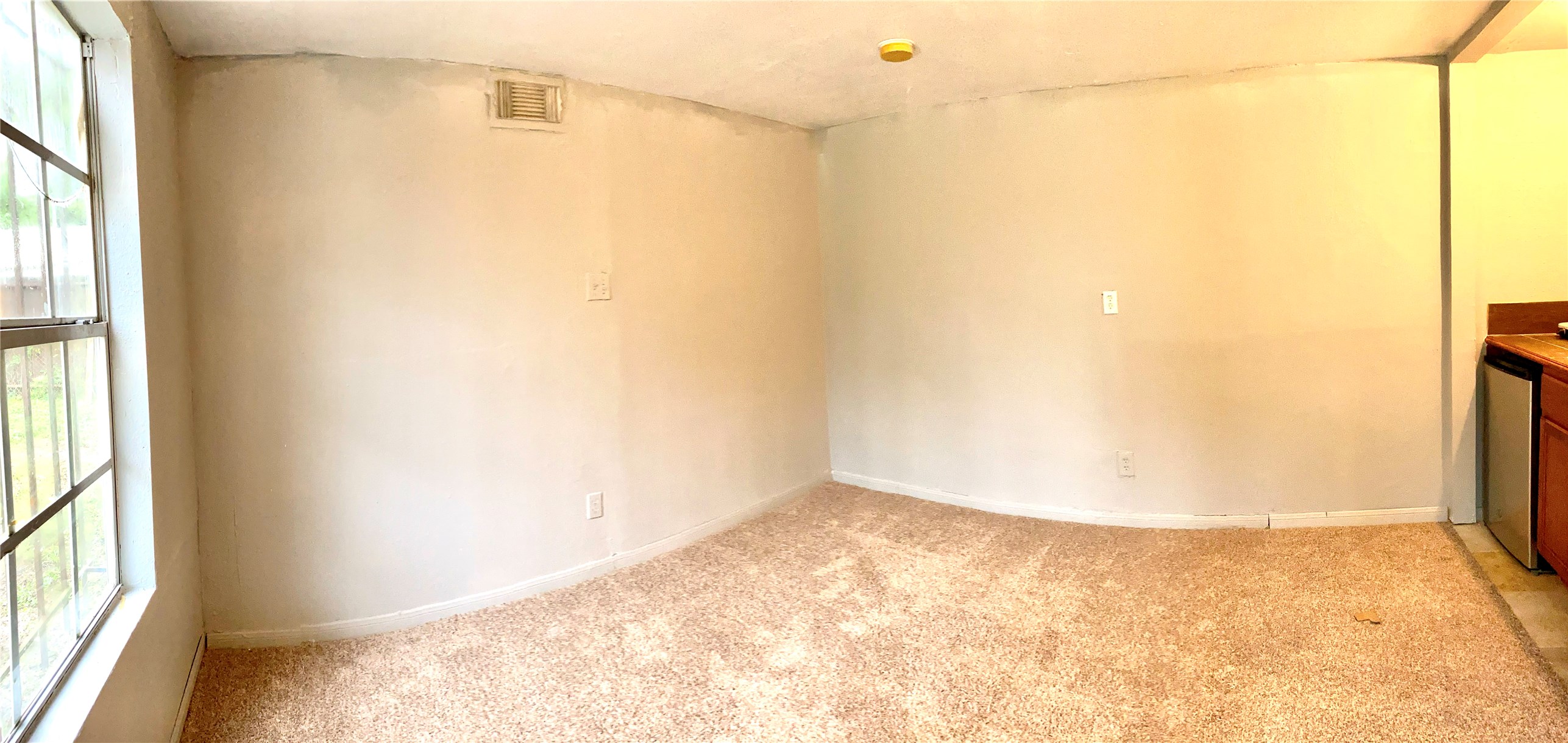 7603 Greendowns Street, Unit B Houston, TX 77087 - Photo 7 of 12 a view of a small space with wooden floor and a window