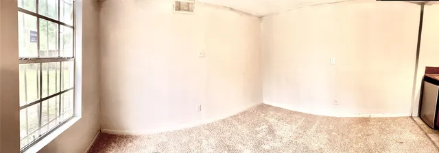 a view of a livingroom and a window