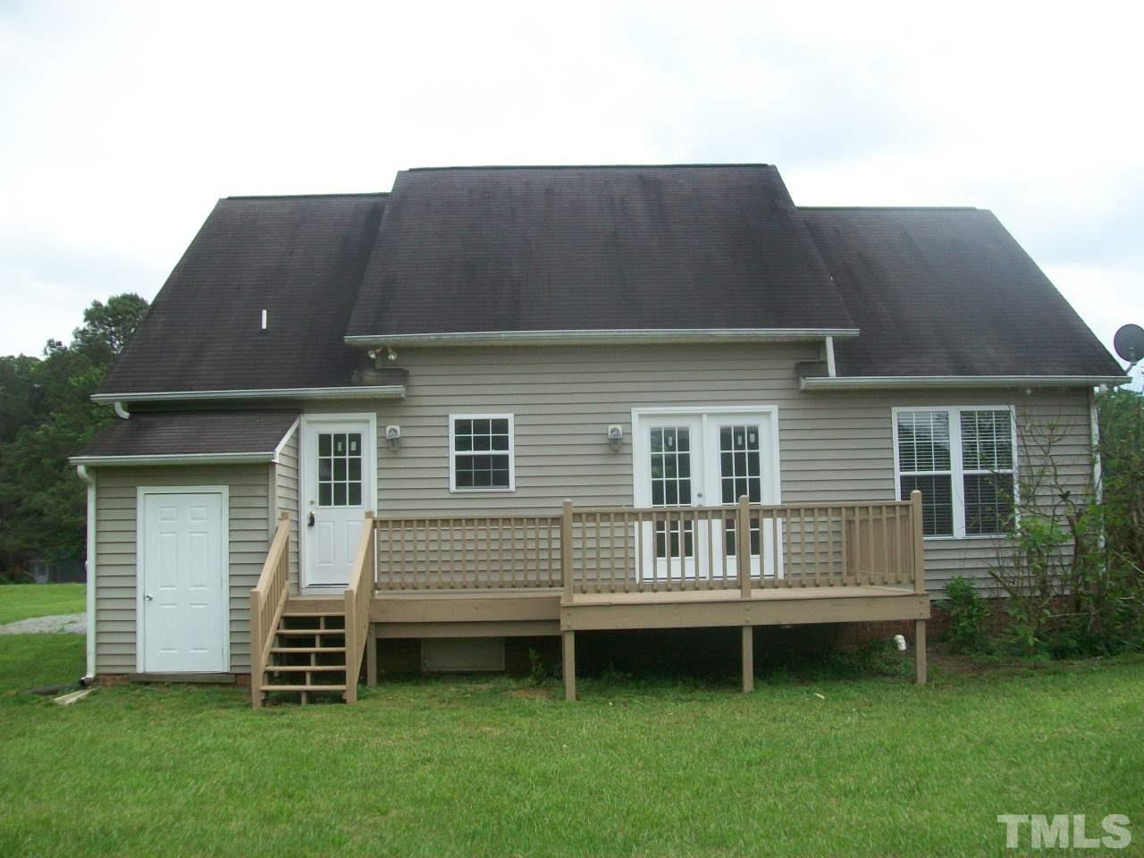 1094 Willie Gray Road Timberlake, NC 27583 - Photo 2 of 15 a house view with a garden space