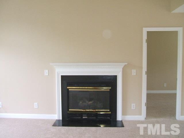 1094 Willie Gray Road Timberlake, NC 27583 - Photo 12 of 15 a living room with a fireplace