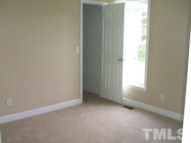 1094 Willie Gray Road Timberlake, NC 27583 - Photo 13 of 15 an empty room with windows