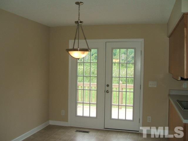 1094 Willie Gray Road Timberlake, NC 27583 - Photo 15 of 15 a view of a room with windows and a chandelier
