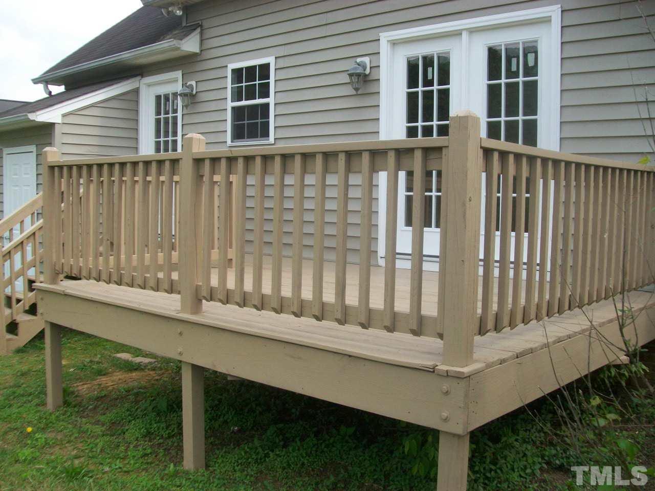 1094 Willie Gray Road Timberlake, NC 27583 - Photo 3 of 15 a view of a wooden chair and table in the balcony