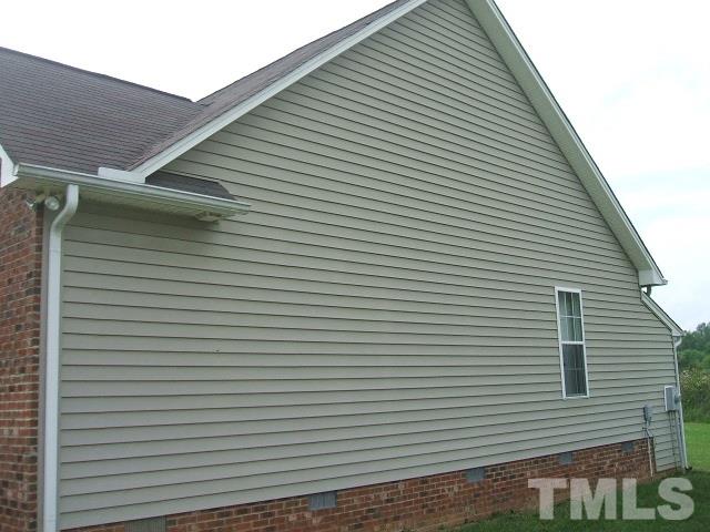 1094 Willie Gray Road Timberlake, NC 27583 - Photo 4 of 15 a view of a white house