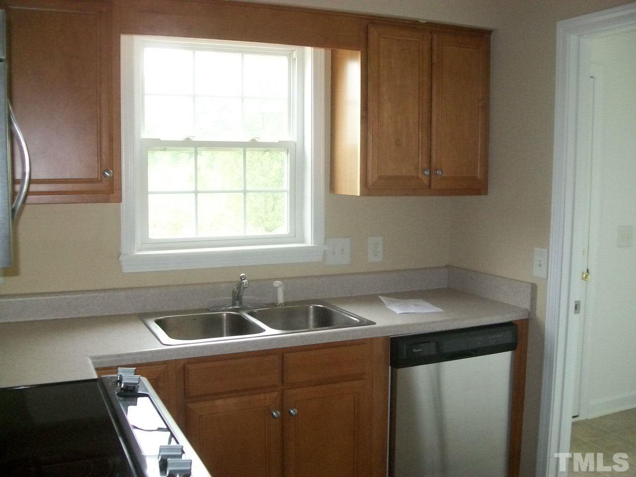 1094 Willie Gray Road Timberlake, NC 27583 - Photo 6 of 15 a view of a sink and dishwasher with a sink