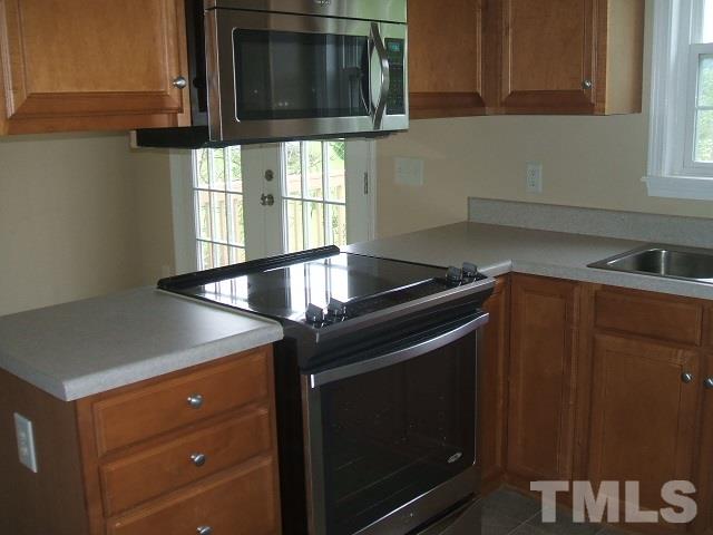 1094 Willie Gray Road Timberlake, NC 27583 - Photo 8 of 15 a kitchen with a sink and cabinets