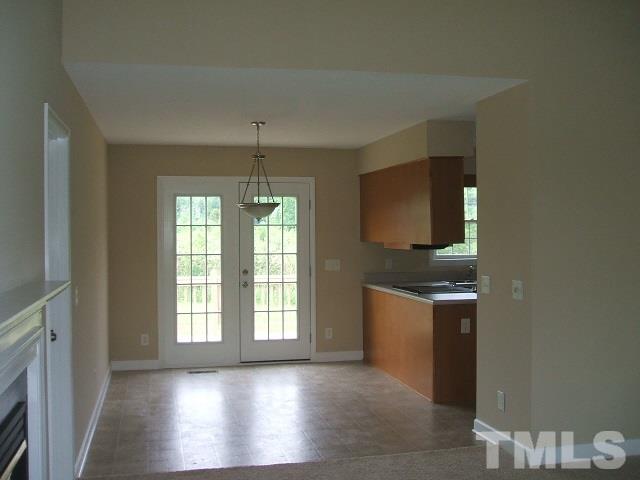 1094 Willie Gray Road Timberlake, NC 27583 - Photo 9 of 15 a view of a kitchen and an entryway