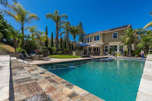 a view of a swimming pool with a patio